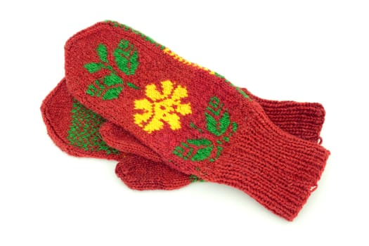 Two crocheted mittens on a white background