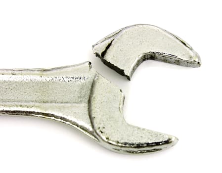 One broken wrench lies on  white background