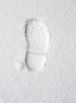 footprint in the white snow in winter