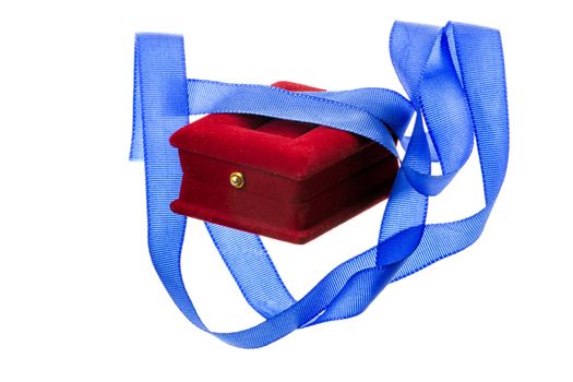 Red velvet gift box and blue ribbon on a white background