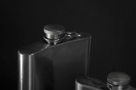 One of the most favorite men's toy - a metal flask for alcoholic beverages. Two used jars of stainless steel for whiskey or brandy