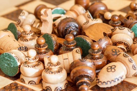 chessboard with an abandoned wooden pieces of chess