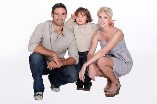 Studio shot of parents and their young son