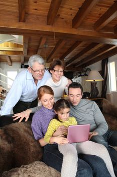 Family in front of a computer