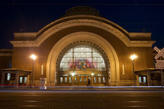 Car pass on Pacific Avenue in front of the Old Union Station