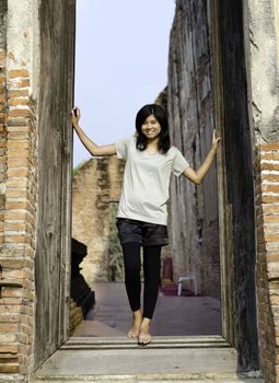 Asian woman enjoying at Buddhist temple in Ayutthaya, Thailand. 