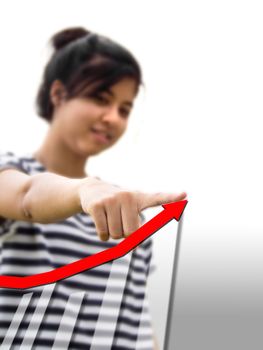 Woman touching a businesss graph.