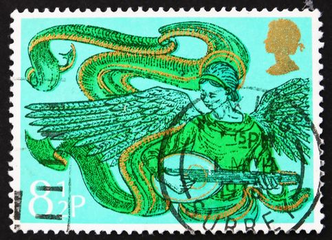 GREAT BRITAIN - CIRCA 1975: a stamp printed in the Great Britain shows Angel with Mandolin, Christmas, circa 1975