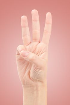 Female hands counting number three isolated on white