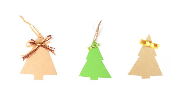 Three christmas tree made of old paper with a small bow and space for Your text