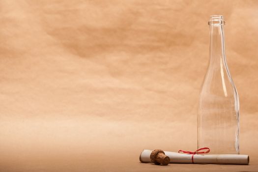 A message next to a glass bottle, isolated on a sand color background, in a studio shot.