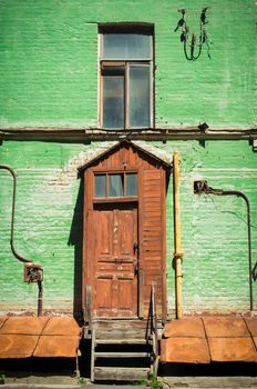 Old painted  brick house with window and door, Kyiv, Ukraine