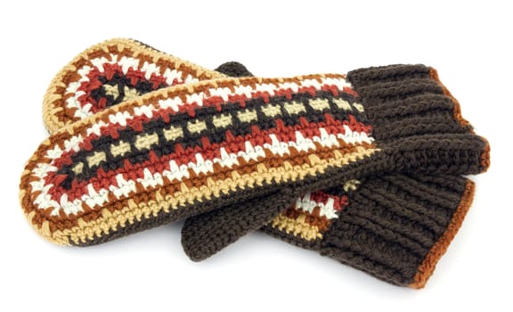 Two crocheted mittens on a white background