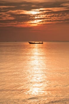 a boat on the sea at sunset in thailand