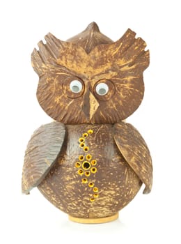 Old wooden carved Owl on table background