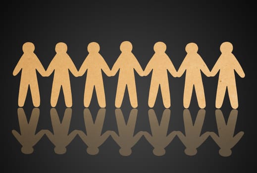 team of paper people on violet background