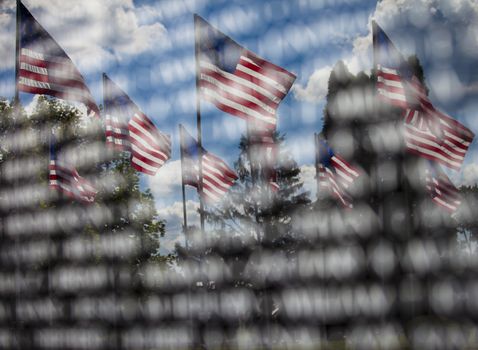 American memorial, the reflection of American Flags in an engraved memorial