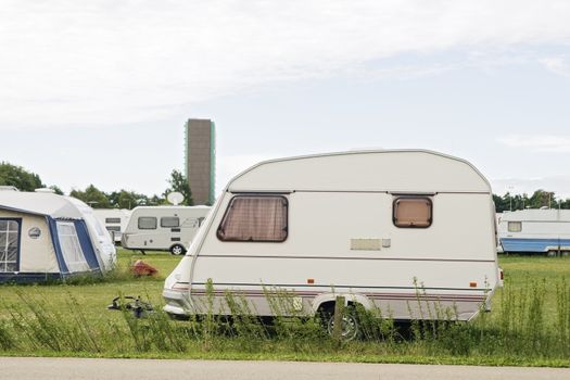 White trailer standing in a camping