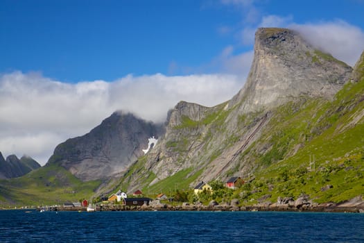 Picturesque mountain peaks towering above fjord on Lofoten islands in Norway