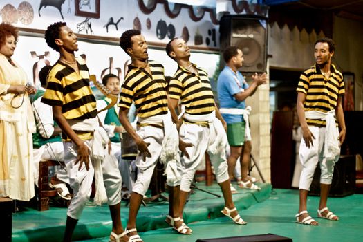 ADDIS ABABA, ETHIOPIA – August 2 - Dancers and musicians perform the traditional dances of different ethnic groups of Ethiopia at a local restaurant on August 2, 2012 in Addis Ababa, Ethiopia