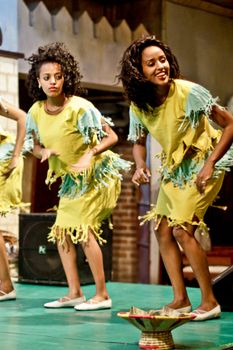 ADDIS ABABA, ETHIOPIA – August 2 - Dancers and musicians perform the traditional dances of different ethnic groups of Ethiopia at a local restaurant on August 2, 2012 in Addis Ababa, Ethiopia