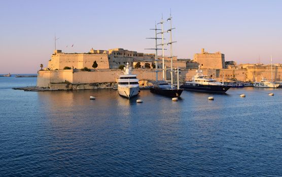 Sunset over the fort St. Angelo in the Grand Harbour of Malta