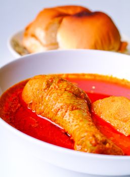 Red Curry Chicken with bun. asia food