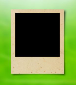 Blank photo frame on green nature background