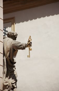 Statue of St. Peter holding gold key to heaven. Prague,Czech Republic