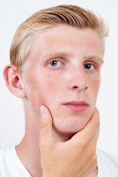 young man with blue eyes Thinking about something on with background 