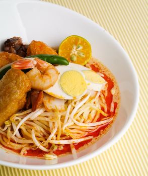 Curry Laksa which is a popular traditional spicy noodle soup from the Peranakan culture in Malaysia and Singapore