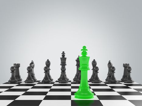Green king against black chess pieces on chess board.