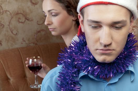 A pair of young and beautiful people are going through a fight on Christmas Eve