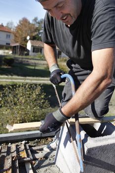 craftsman cutting a board