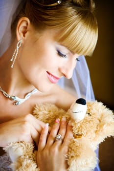 bride and toy bear