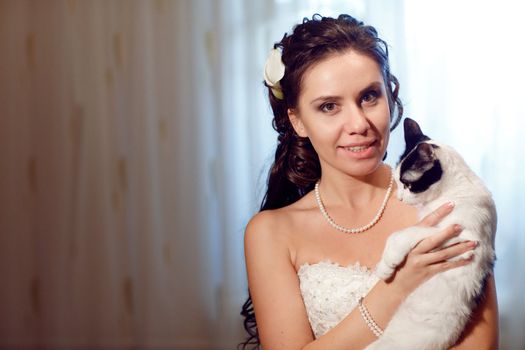 bride with a Siamese cat