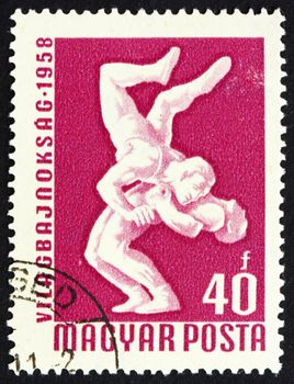 HUNGARY - CIRCA 1958: a stamp printed in the Hungary shows Wrestlers, International Wrestling Championships, Budapest, circa 1958