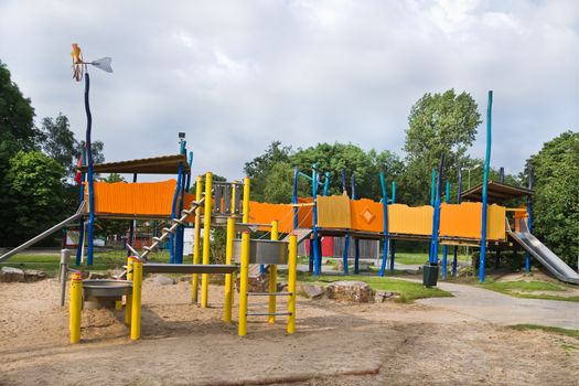 Playground for children in public park with slidings and watermachine