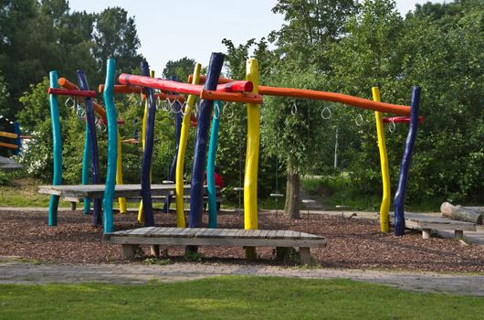 Colorful climb- and swing construction in public park