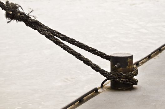 Ship rope and mooring-mast with desaturated colors