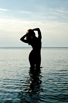 Silhouette of woman in the sea