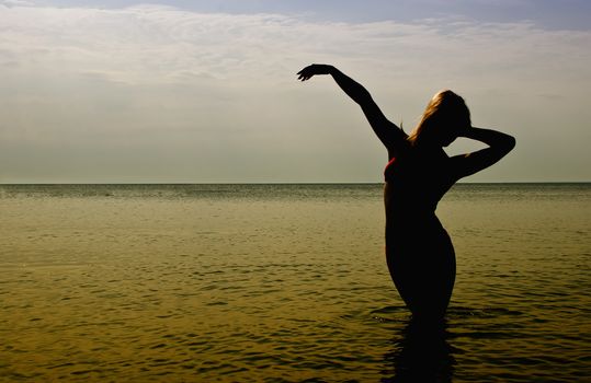 Silhouette of woman in the sea