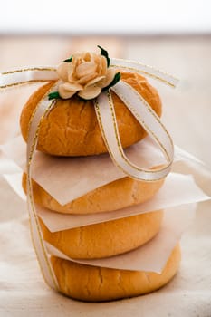 Vanilla cookies as present on napkin and wooden table