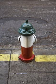 Fire hydrant in Little Italy area of New York painted in the colours of the Italian flag.