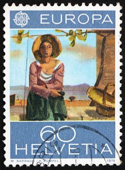 SWITZERLAND - CIRCA 1975: a stamp printed in the Switzerland shows Vineyard Worker, Painting by Maurice Barraud, circa 1975