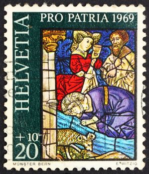 SWITZERLAND - CIRCA 1969: a stamp printed in the Switzerland shows Israelites Drinking from Spring of Moses, Berne Cathedral, circa 1969