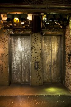 Elevators inside Chelsea Market surrounded by safety deposit boxes from bank.







Elevators lit with grunge effect