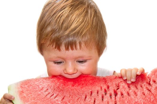 Sweet little girl eating a slice of watermelon on white background 