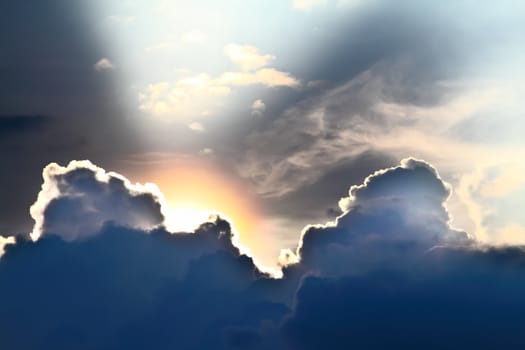 View of clouds in sky with rays of light