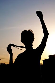 silhouette of man with medal prize